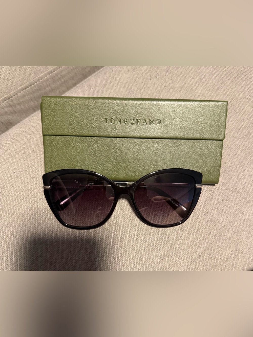 Longchamp Black Cat-Eye Sunglasses with Gradient Purple Lenses